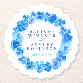 Blåblommiga underlägg av kransfärgade vattenfärger papper