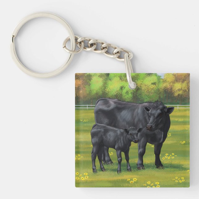 Black Angus Cow & Cute Calf på sommarbetesmark (Framsidan)