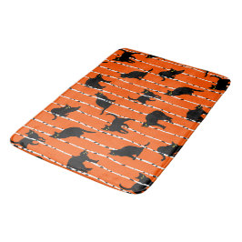 Black Cats and Birch Branches on Vibrant Orange Badrumsmatta