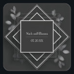 Black Geometric Frame Botanical Accents Wedding Fyrkantigt Klistermärke<br><div class="desc">Elevate your wedding presentation with this Elegant Black & White Geometric Frame Wedding Sticker, an effortlessly chic design that merges symmetry, minimalism, and natural elegance. The square-centered layout is framed with crisp white lines over layered black diamond shapes, creating a visually striking, modern contrast. Delicate gray-toned botanical leaves peek from...</div>