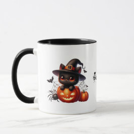 Black Kitten i en Halloween Pumpkin Mugg