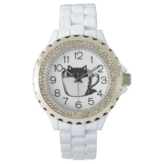 Black kitten with red nose hiding in a cup armbandsur