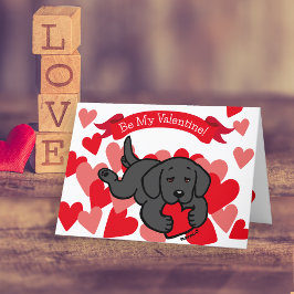 Black Labrador Puppy Chewing Heart Valentine Helgkort