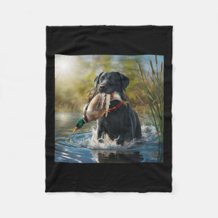 Black Labrador Retriever Hund som jagar Ankor i en Fleecefilt