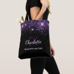 Black lila glitter stoftmonogram initialer tygkasse<br><div class="desc">En svart bakgrund för eleganten. Dekorerad med damm från lila faux glitter. Anpassa och lägg till ditt första namn,  monogram initialer och fullt namn. Namn är skrivet med ett handskript i stil.</div>
