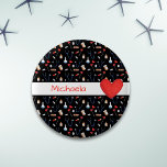 Black Medical Equipment Pattern Red Heart Knapp<br><div class="desc">Cute personalize black button with a background of a medical equipment. From adhesive bandages, pills, bottles to blue stethoscopes. In the middle front there is a wide white line with the red text that you can personalize. On the right side of the text, there is an illustrated red heart. Customize...</div>