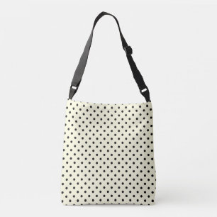 Black polka dots-design på grädde axelväska