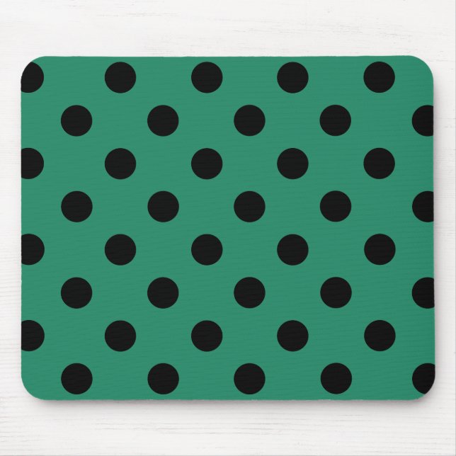 Black polka dots in green musmatta (Framsidan)