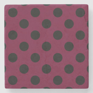 Black polka dots på burgundy stenunderlägg