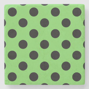 Black polka dots på kalkgrönt kalk underlägg sten