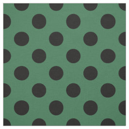 Black polka dots på kelly grönt tyg