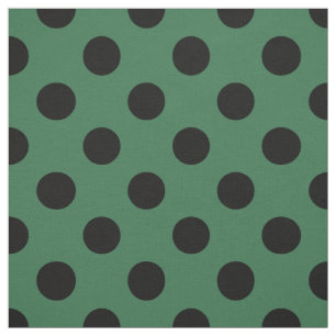 Black polka dots på kelly grönt tyg