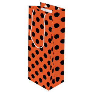 Black polka dots på orange
