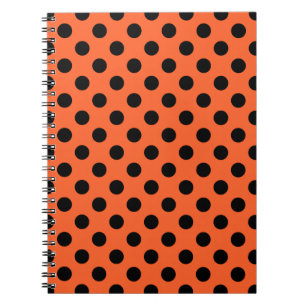 Black polka dots på orange anteckningsbok