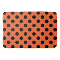 Black polka dots på orange