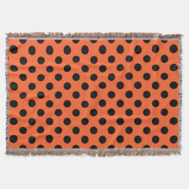 Black polka dots på orange filt