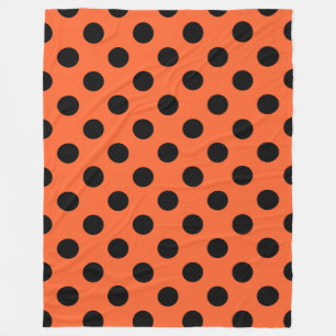 Black polka dots på orange fleecefilt