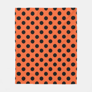 Black polka dots på orange fleecefilt
