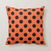 Black polka dots på orange