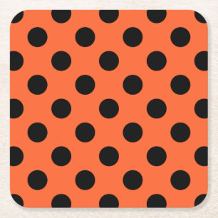 Black polka dots på orange underlägg papper kvadrat