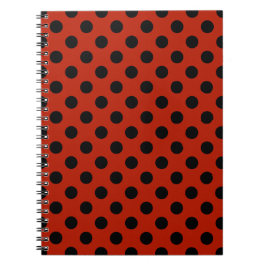 Black polka dots på röd anteckningsbok
