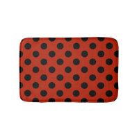 Black polka dots på röd