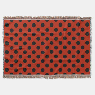 Black polka dots på röd mysfilt