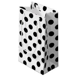 Black polka dots på vit