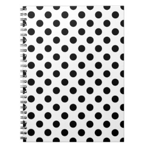 Black polka dots på vit anteckningsbok med spiral