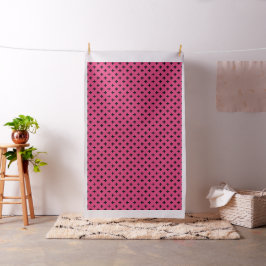 Black polka kor på fuchsia tyg