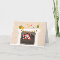 Black Santa fastnade i eldstaden