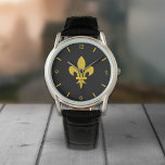 Black Watch med Guld Fleur de Lis Armbandsur<br><div class="desc">En svart klocka med en guld fleur de lis: en perfekt gåva till en elegant man!</div>