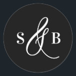 Black Whimsical Calligraphy Wedding Monogram Runt Klistermärke<br><div class="desc">Add a charming finishing touch to your wedding stationery or favors with this wedding sticker featuring a whimsical calligraphy ampersand. Designed with a romantic yet modern flair, this sticker is perfect for sealing envelopes, decorating favor boxes, or adding a personalized detail to welcome bags and more. The hand-drawn ampersand adds...</div>