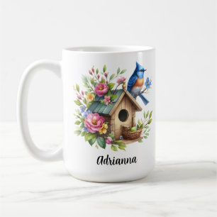 Blåfågel fågelhus blommor vårträdgård kaffemugg