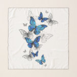 Blåflygande fjärilar Morpho Sjal<br><div class="desc">Flygande blå Butterflies morpho och vita fjärilar på en ljus abstrakt bakgrund. Morpho. Design med blå fjärilar morfin.</div>