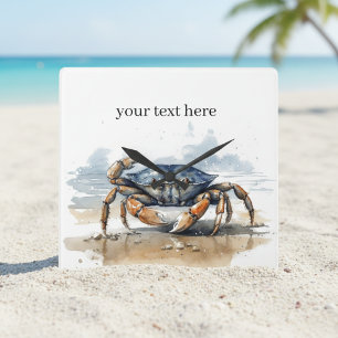 Blåkrabba och orange krabba på stranden fyrkantig klocka