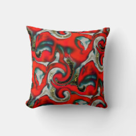 Blandning av abstrakt i rött övertoningsfläckar öv kudde