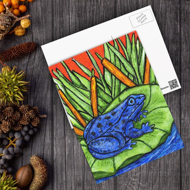 Blåsambandsgroda vykort (Vibrant blue frog black spots on lily pad green reed plants in water on postcard.)