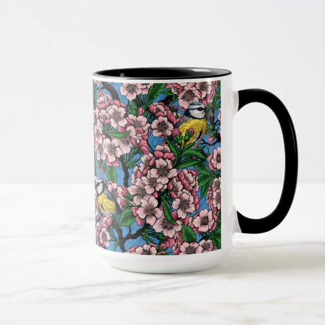 Blåtmålsfåglar i blommande körsbär träd på blått mugg (Höger)