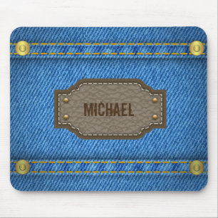 Blåttdenimjeans med lädernamnetiketten musmatta
