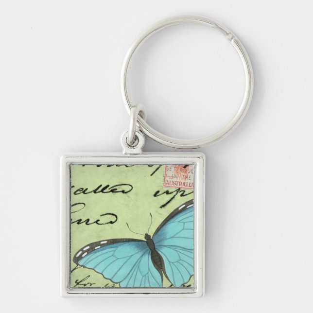 Blåvingad fjäril på blåvykort fyrkantig silverfärgad nyckelring (Framsidan)
