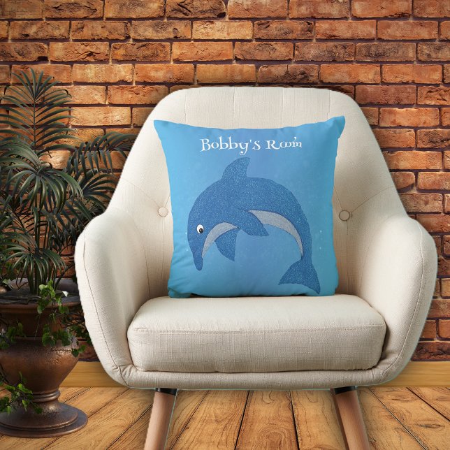 Blåvit jumpedunfin i Tecknad på Blue Kudde (Bright blue throw pillow with cute jumping dolphin in dark blue and white for kids bedroom.)