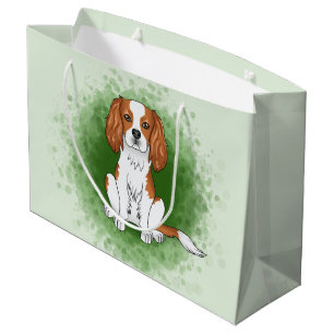 Blenheim Cavalier King Charles Spaniel på grönt