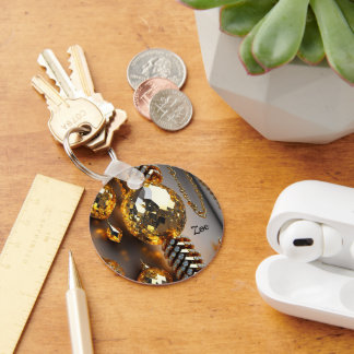 Blink! Vackra kaosjuveler i guld Nyckelring