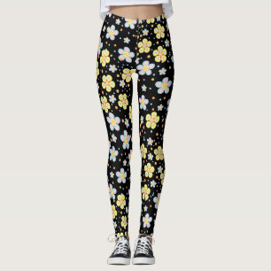 Blommande tusenskönor. Gula och rosa svart bakgrun Leggings