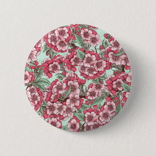Blommar av körsbär i rosa och mynta knapp