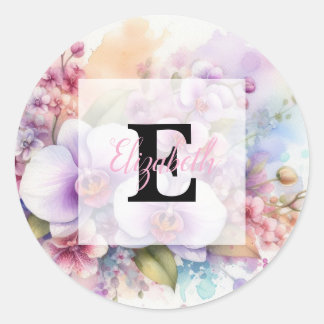 Blommig akvarellmonogram rosa orkidéblommor runt klistermärke