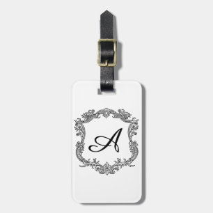 Blommig kant med monogram bagagebricka