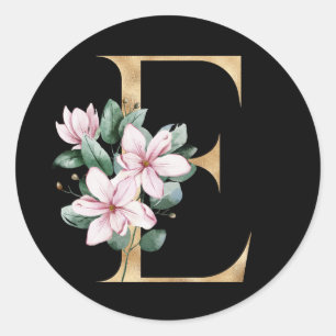 Blommig magnolia-monogram i guld bokstav E Runt Klistermärke