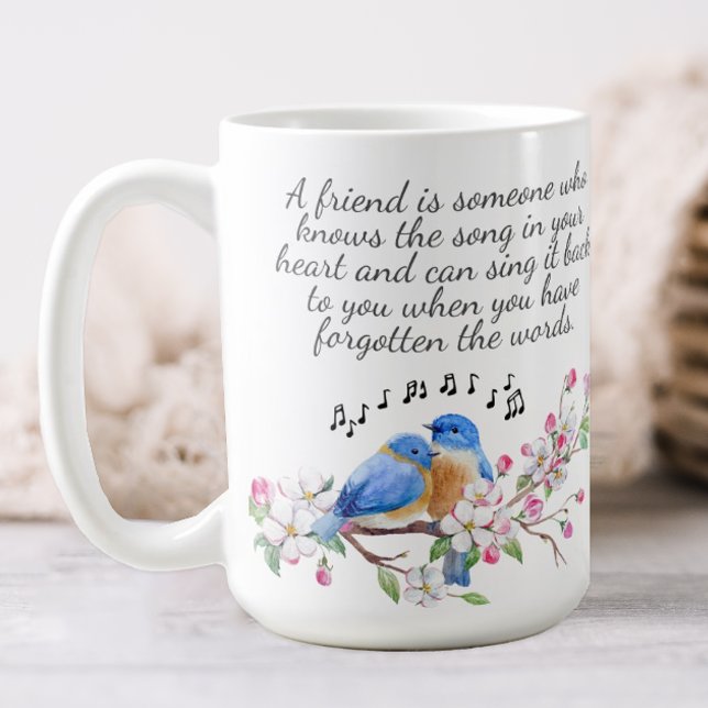 Blommig Vänskap Kaffemugg (A pretty floral mug decorated with birds and flowers and a quote about friendship.)